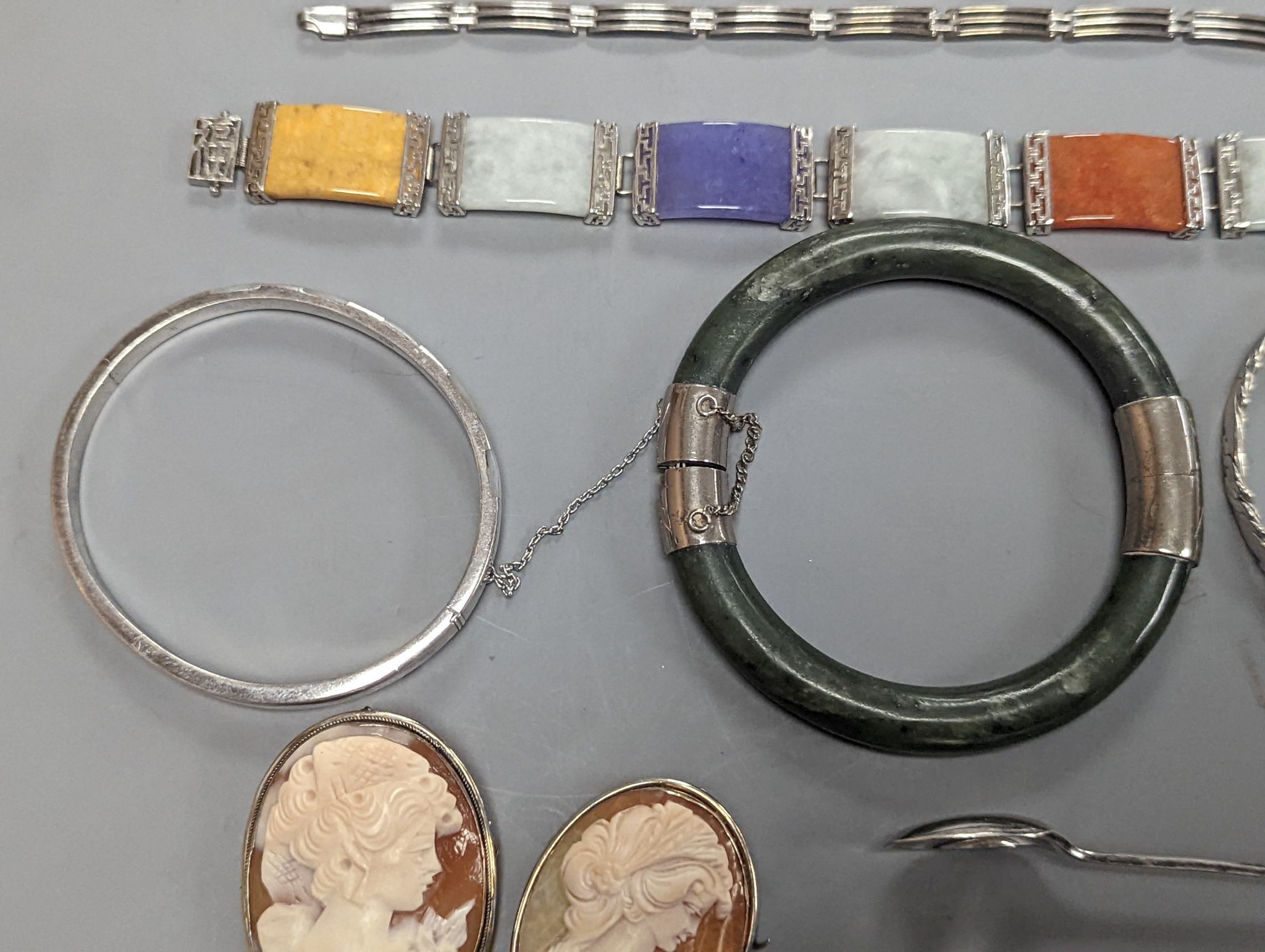 A 925 and hardstone set bracelet, 19.7cm, one other bracelet, two cameo shell brooches, three assorted bangles and a pair of sugar tongs.
